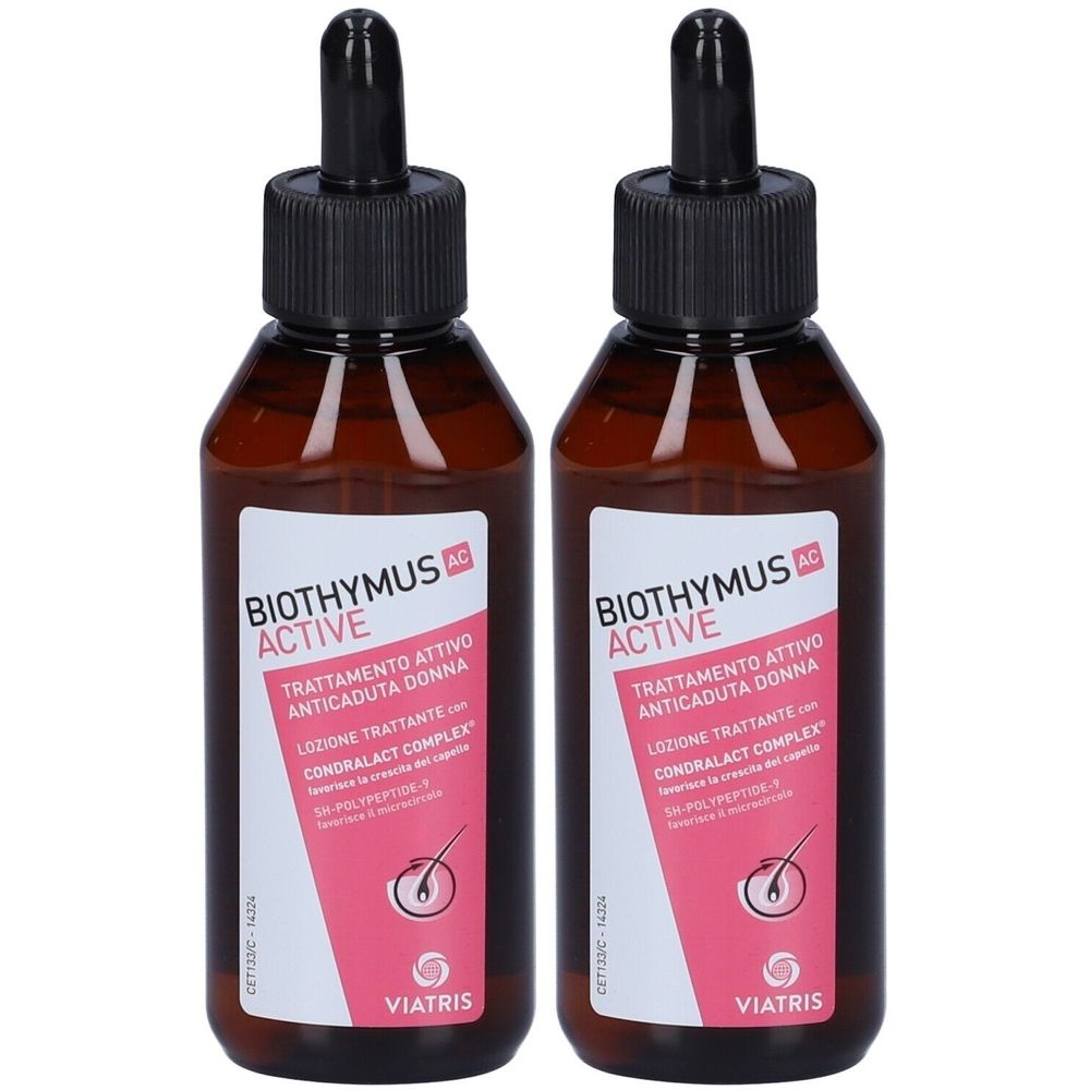 Due flaconi di liquido marrone con contagocce neri. Etichette: "BIOTHYMUS ACTIVE" e "Trattamento Attivo Anticaduta Donna".