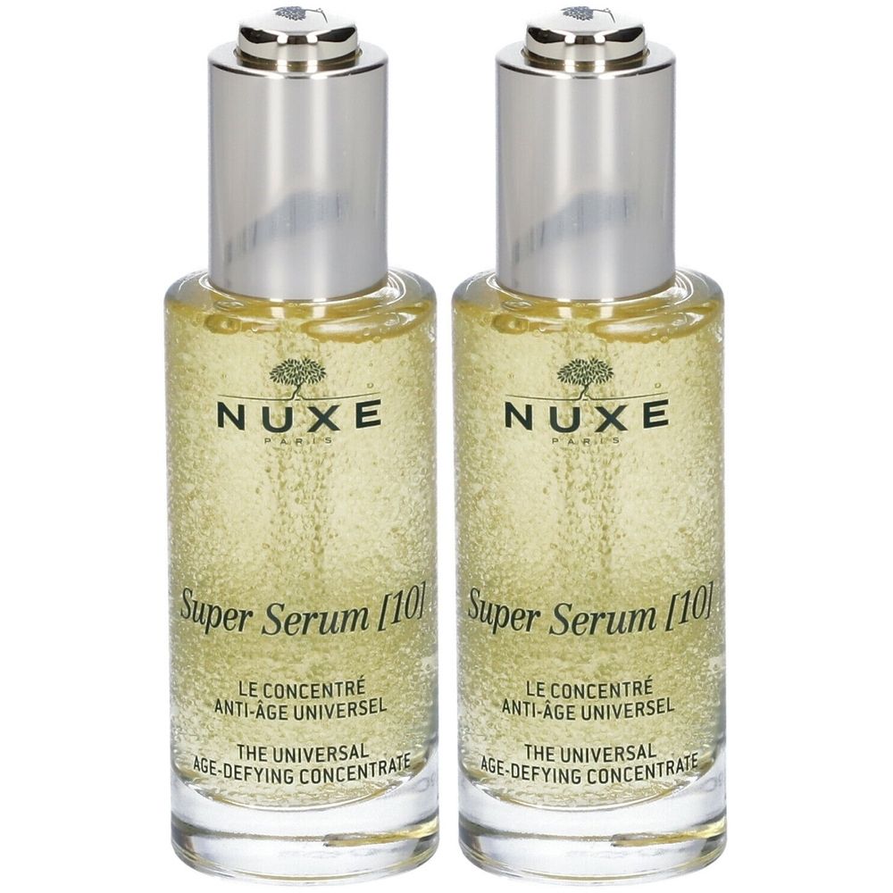 Due flaconi con tappi argentati. Le etichette riportano "NUXE Super Serum [10]" e "LE CONCENTRE ANTI-AGE UNIVERSEL".