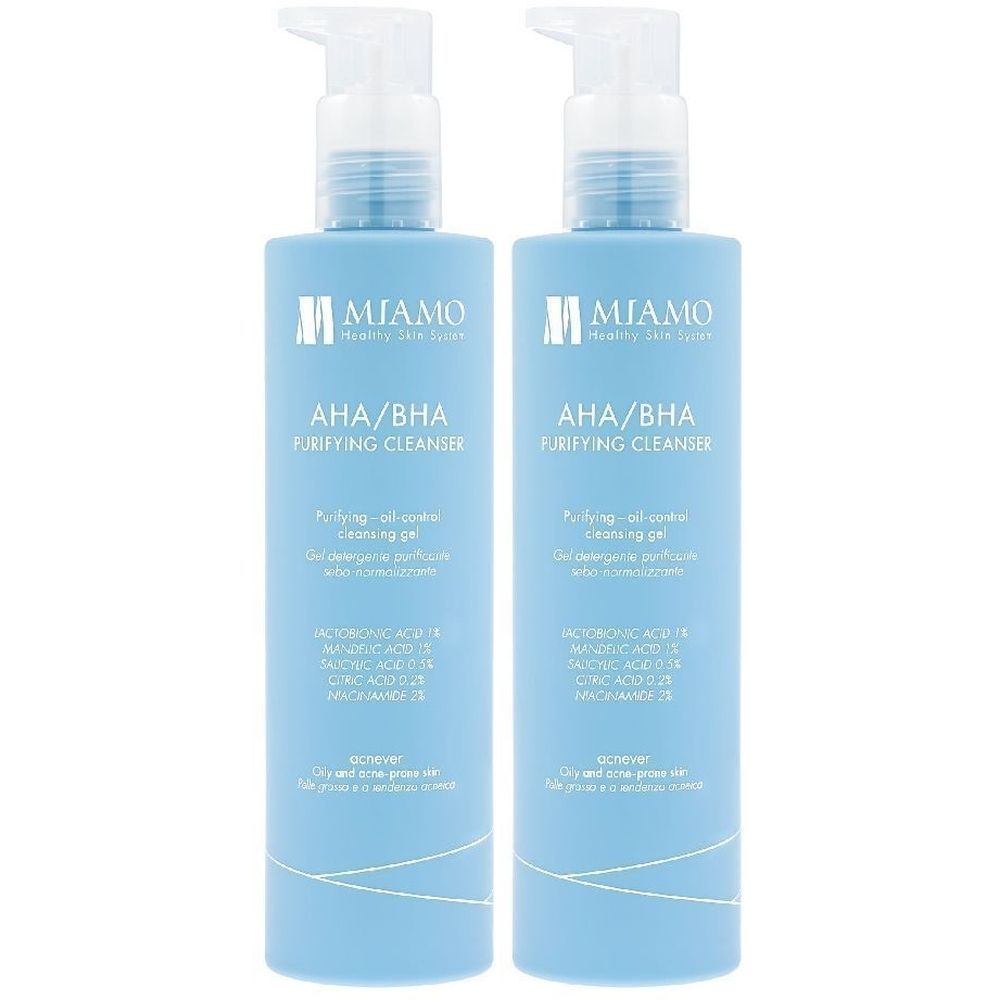 Due flaconi blu con dosatore. Scritta: MIAMO AHA/BHA Purifying Cleanser. Contiene informazioni sugli ingredienti e logo.