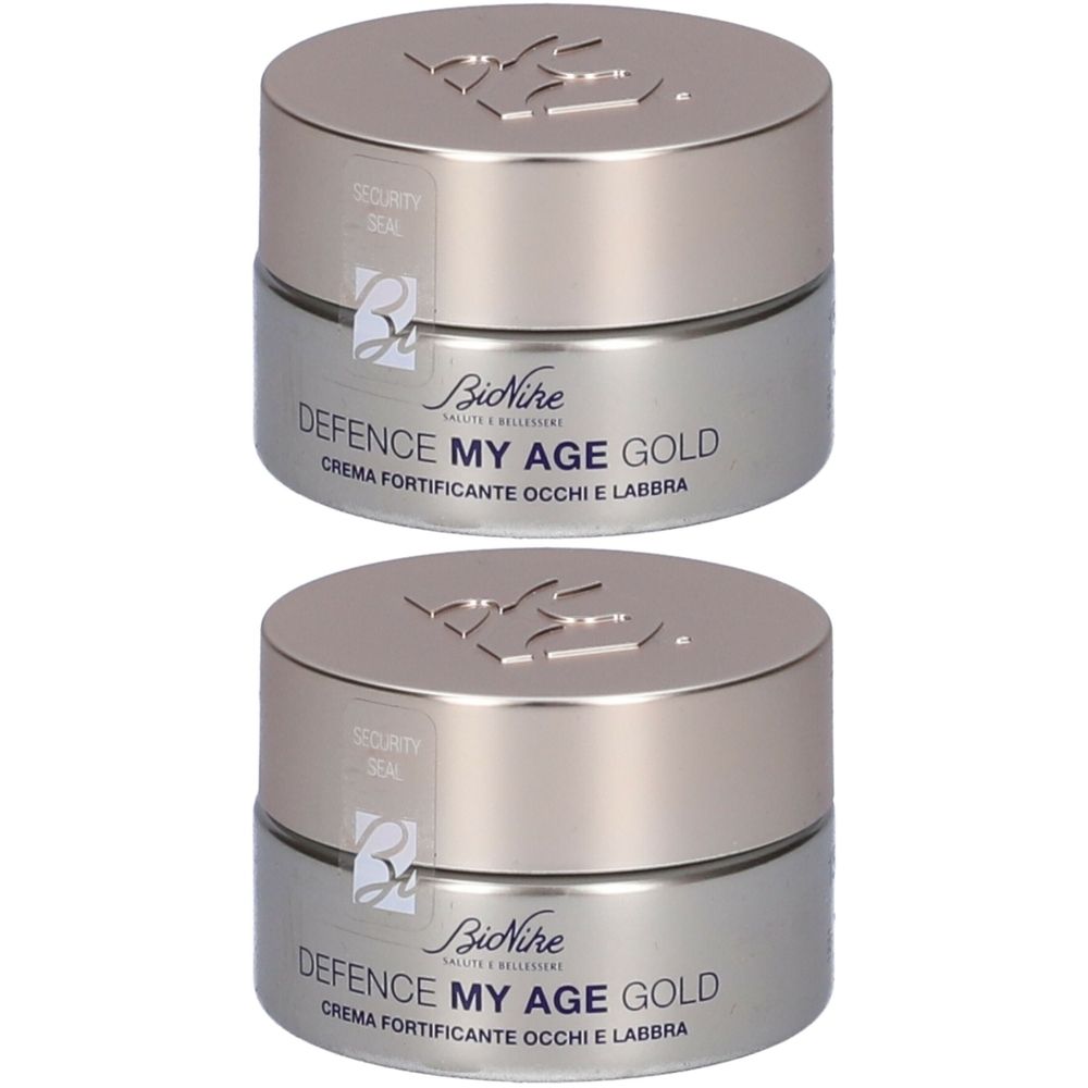 Due vasetti argentati con coperchi. Scritta: Defence My Age Gold, Crema Fortificante Occhi e Labbra. Marchio: BioNike.