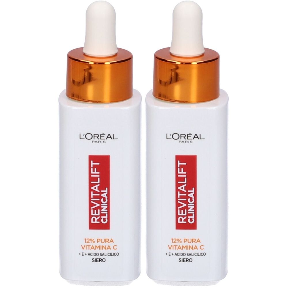 Due flaconi bianchi con tappi dorati e pipette. Ogni flacone riporta "L'Oréal Paris Revitalift Clinical" e "12% Pura Vitamina C".