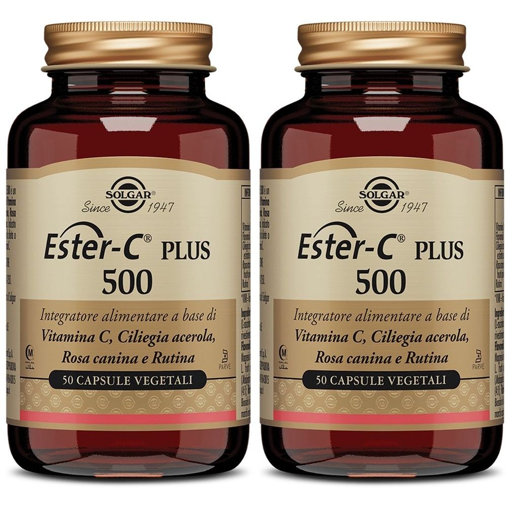 Due flaconi in vetro marrone con tappi dorati. Ogni flacone riporta la scritta "Ester-C PLUS 500" e "SOLGAR".