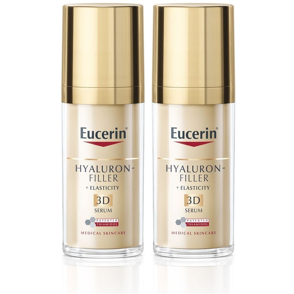Due flaconi di siero Eucerin Hyaluron-Filler + Elasticity 3D. Tappi dorati, flaconi trasparenti con etichette bianche.