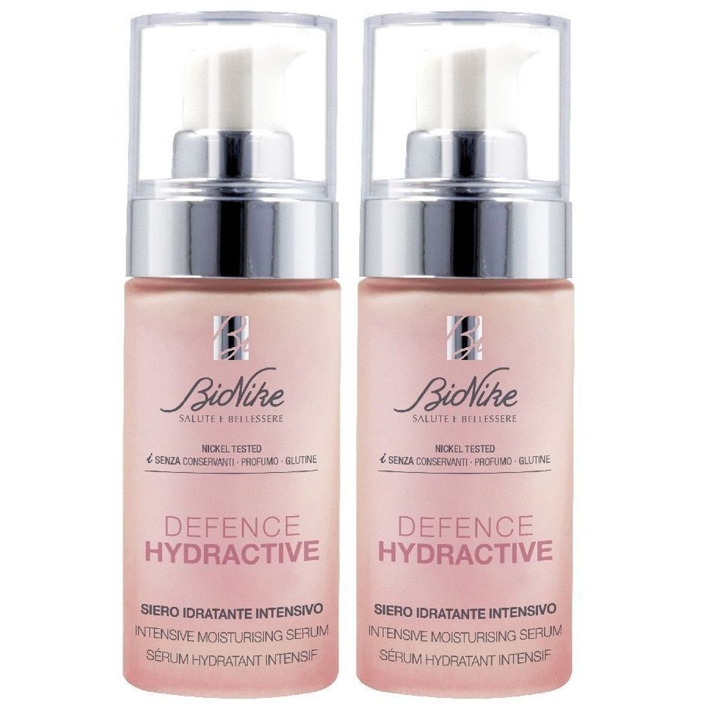 Due flaconi di siero. Liquido rosa in flaconi trasparenti con dosatore a pompa. Scritta: Defence Hydractive, BiNike.