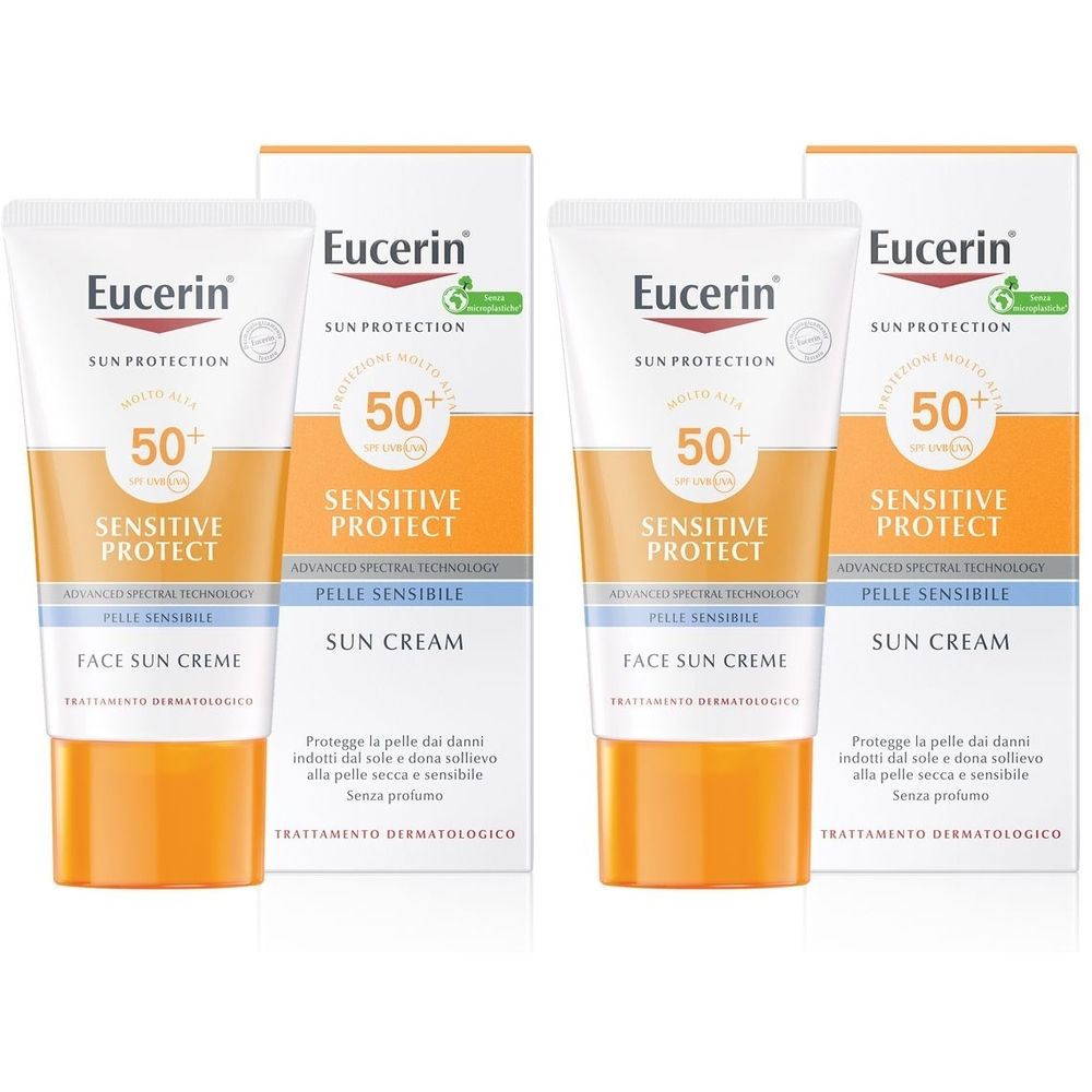 Due tubi e confezioni Eucerin Sun crema sun Viso FP 50+. Tubi arancioni e bianchi, confezione bianca con informazioni.