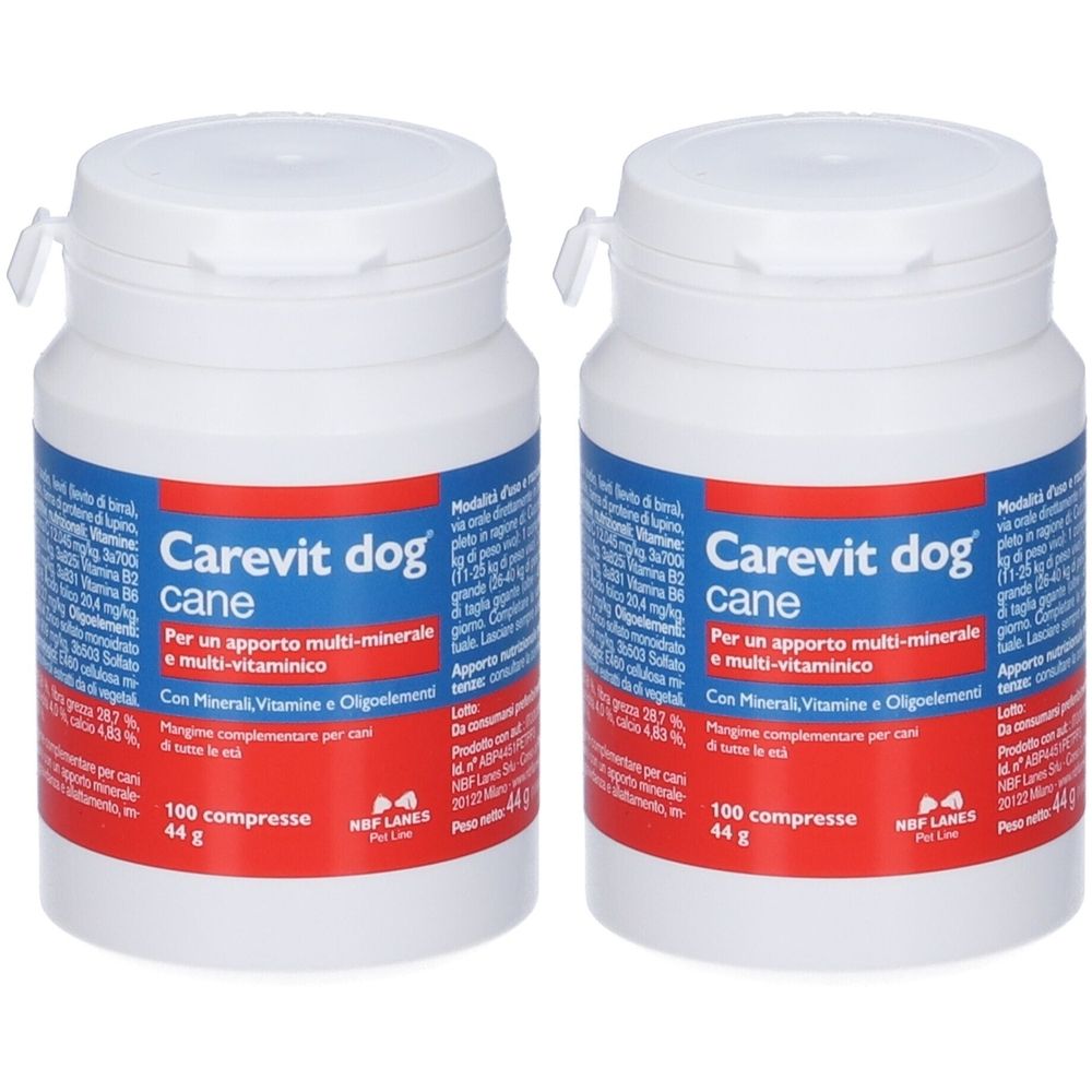 Due flaconi bianchi con etichetta blu. Scritta: Carevit dog cane, 100 compresse. Integratore per cani.