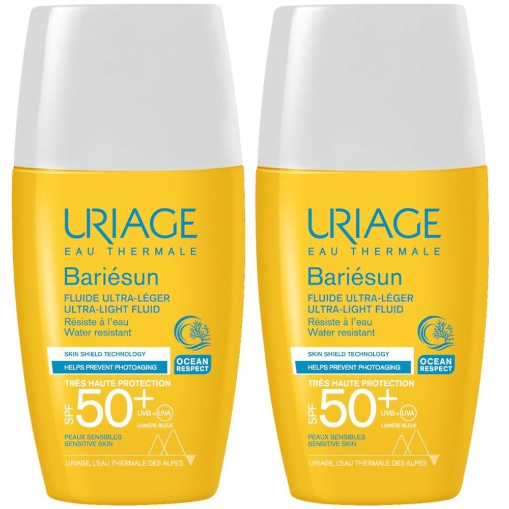 Due flaconi gialli con tappo bianco. Scritta: URIAGE, Bariésun, SPF 50+. Fluido ultra-leggero. Resistente all'acqua.