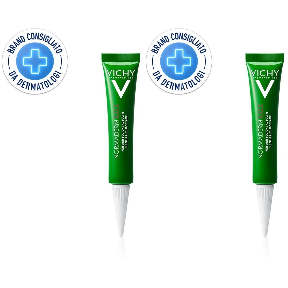 Tubo verde con punta bianca. Scritta: Vichy, Normaderm. Logo rotondo con croce blu e testo: Brand Consigliato da Dermatologi.