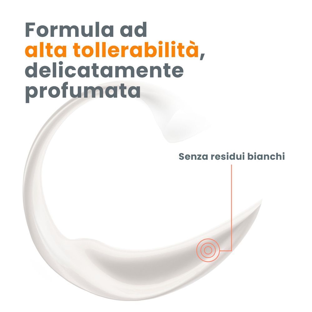 Macchia di crema bianca. Testo: Formula ad alta tollerabilità, delicatamente profumata. Senza residui bianchi.