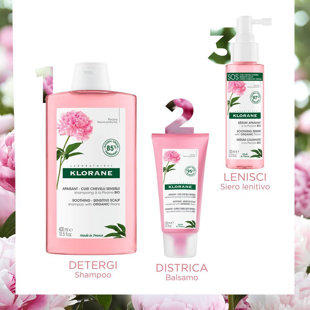 Tre prodotti: shampoo, balsamo e siero. Confezione rosa. Etichetta verde e bianca con logo e nome del prodotto.