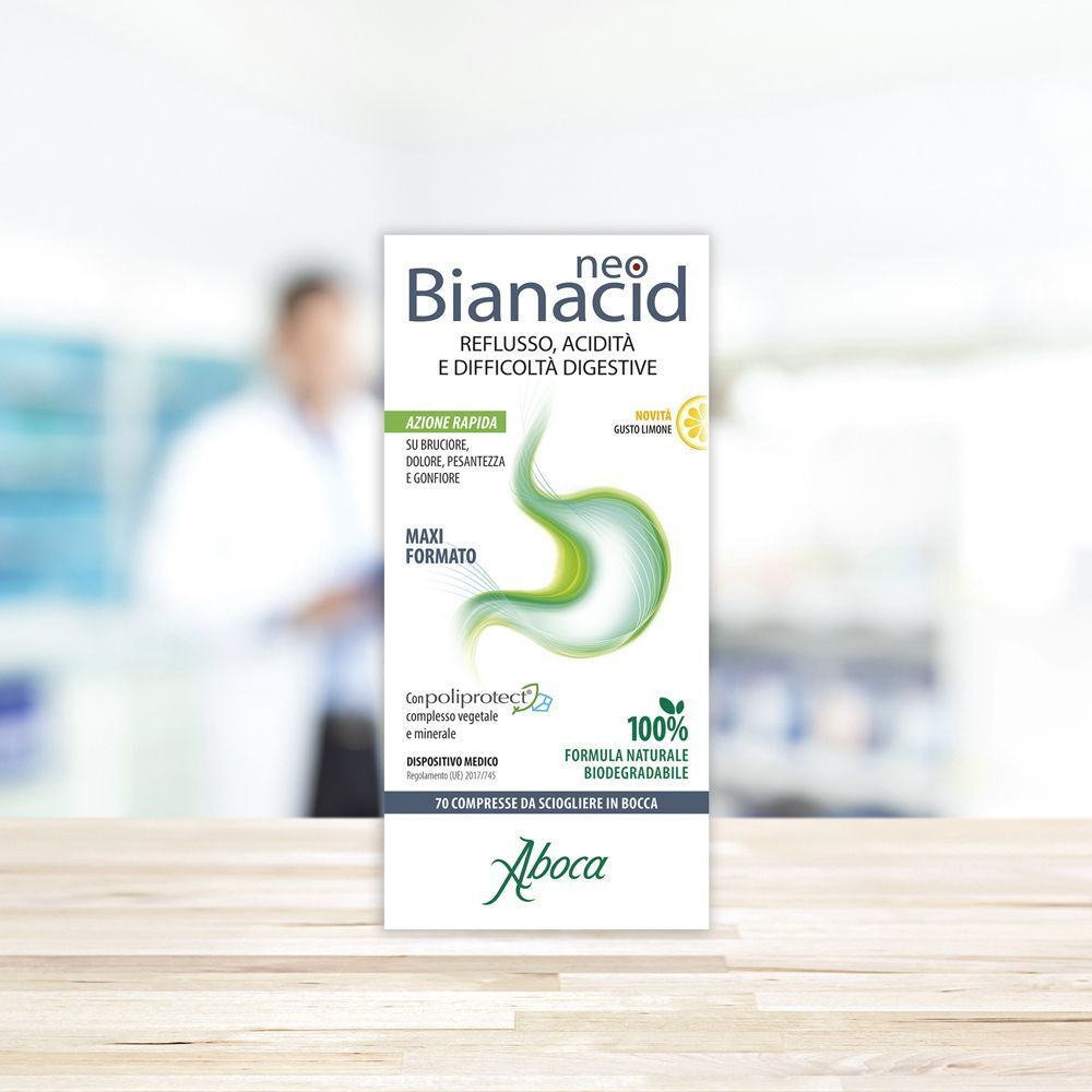 Scatola di Neobianacid. Confezione bianca con nome del prodotto e illustrazione verde dello stomaco. Logo Aboca. Gusto limone.