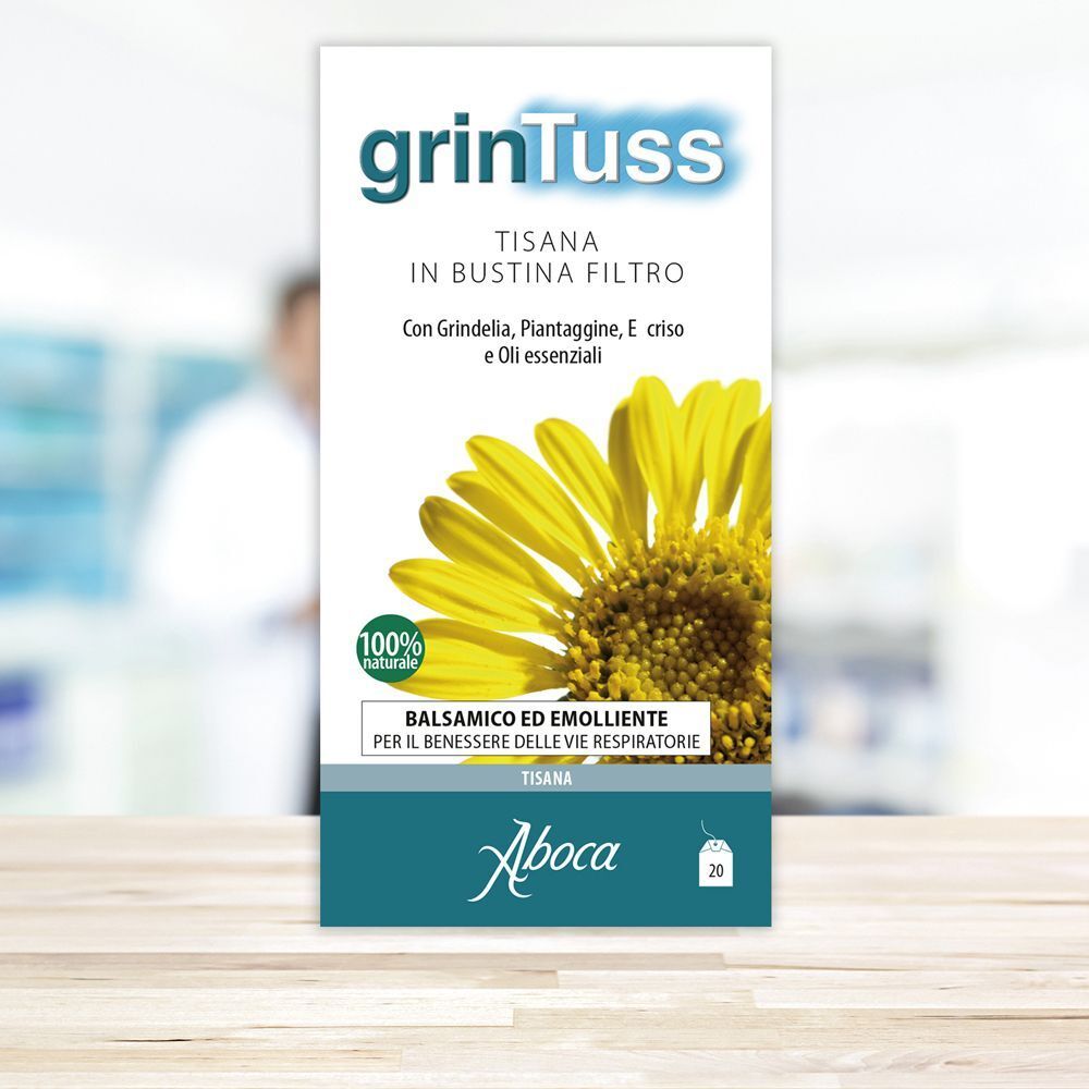 Confezione con design verde e bianco. Scritta: grinTuss, Tisana in bustina filtro. Logo Aboca. Fiore giallo. 100% naturale. 20 bustine.