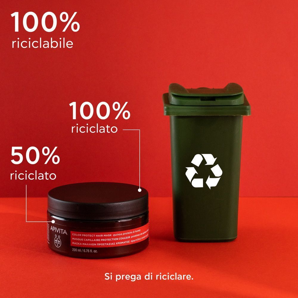 Maschera capelli APIVITA Color Seal accanto a un bidone di riciclaggio verde. 100% riciclabile.