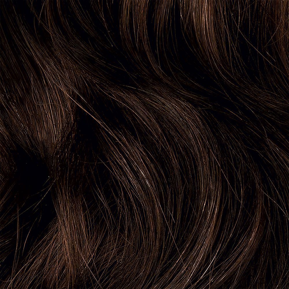 Primo piano di capelli scuri e ondulati.