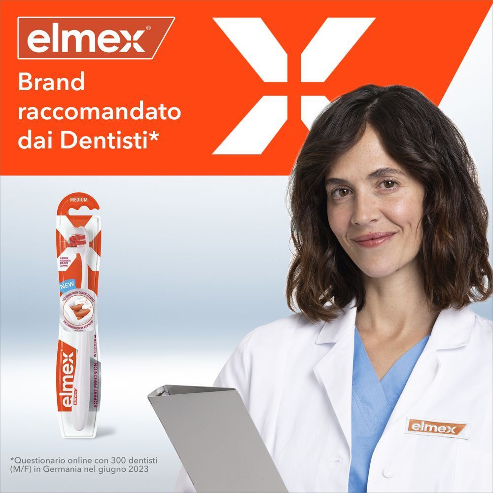 Dentista con spazzolino Elmex Spazzolino Interdental Expert Precision, che indica la raccomandazione dei dentisti.