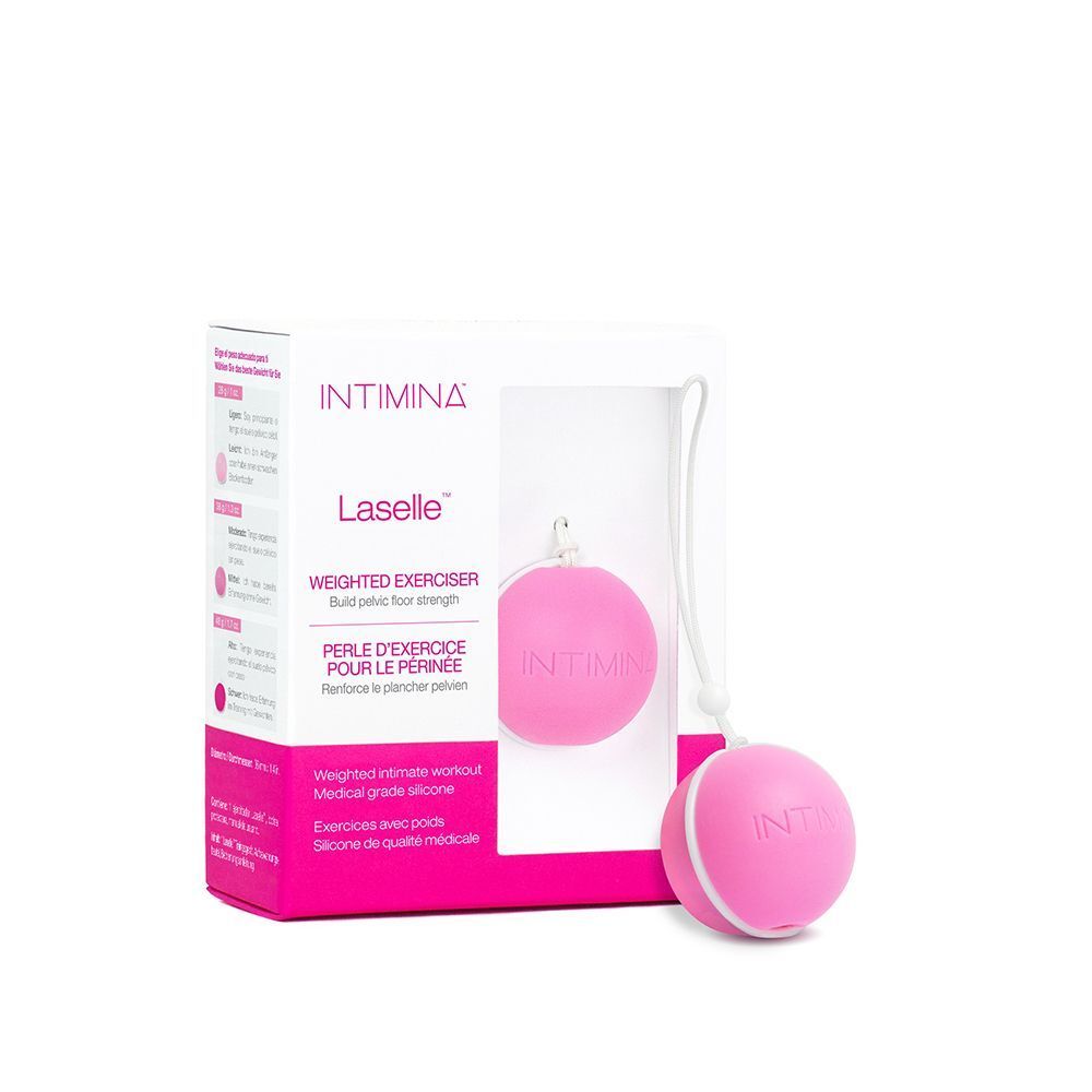 Una sfera Kegel rosa con cordino, accanto alla sua confezione. La confezione mostra informazioni sul prodotto.