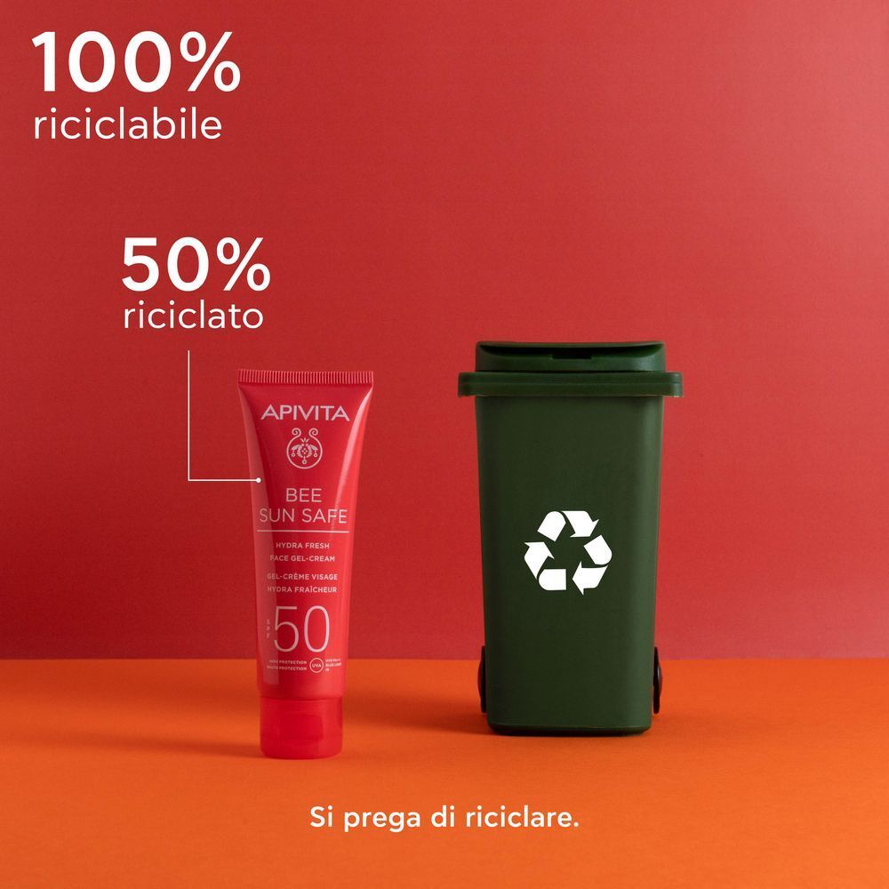 APIVITA Bee Sun Safe Crema Gel Viso SPF50 accanto a un contenitore per il riciclo.