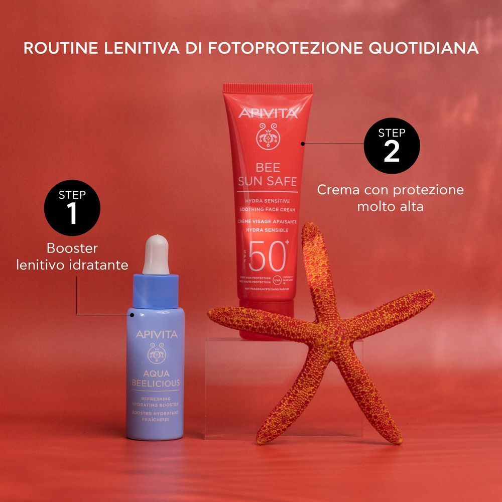 Crema solare viso APIVITA SPF 50+ e flaconcino di siero, parte di una routine di cura.