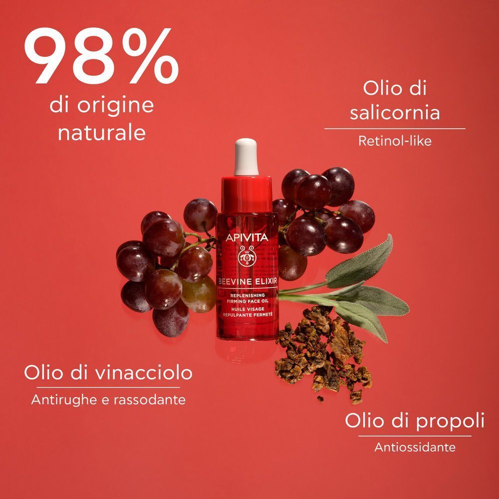 Flacone Olio Viso Apivita Beevine Elixir accanto a uva, salicornia e propoli. 98% origine naturale.