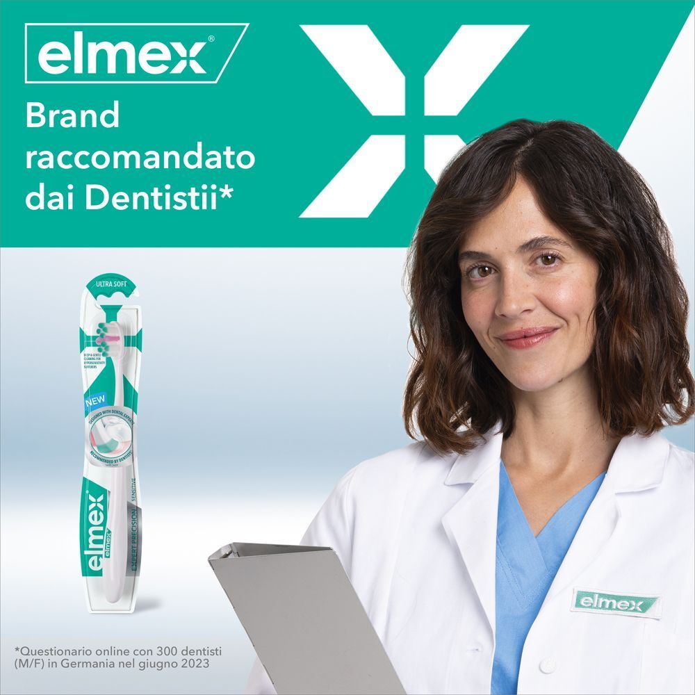 Dentista con spazzolino Elmex Sensitive Expert Precision, marca raccomandata dai dentisti.