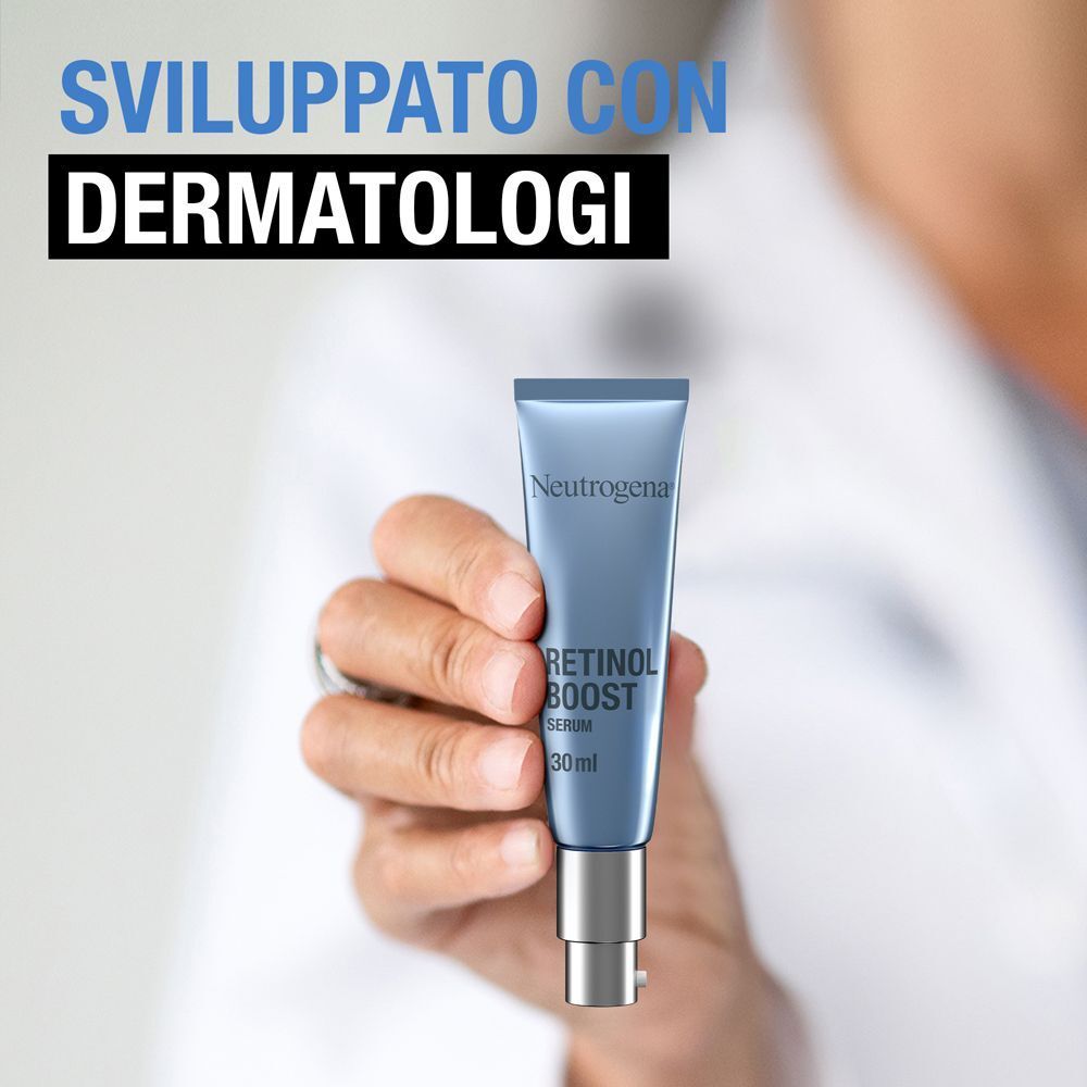 Mano che tiene un flacone di siero Neutrogena Retinol Boost 30ml con pompa. Testo: Sviluppato con dermatologi.