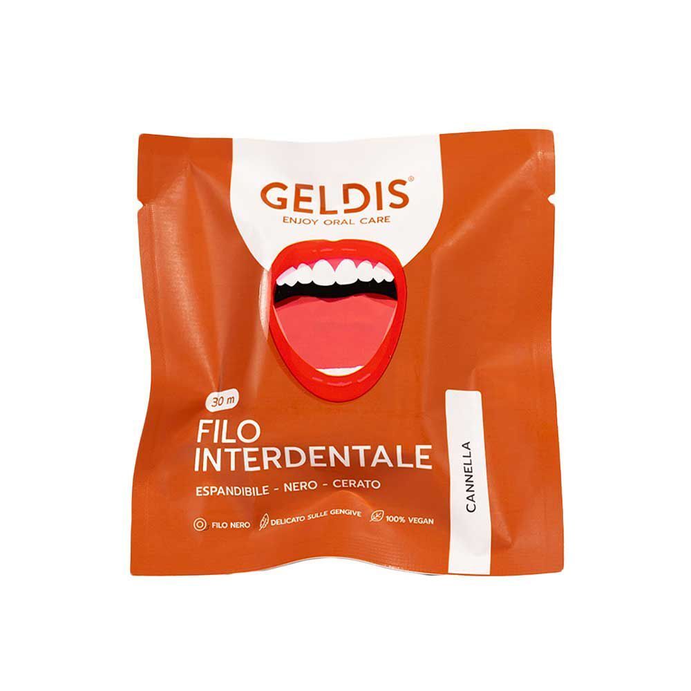 Una singola confezione di filo interdentale GELDIS gusto cannella. Confezione arancione con immagine di denti.