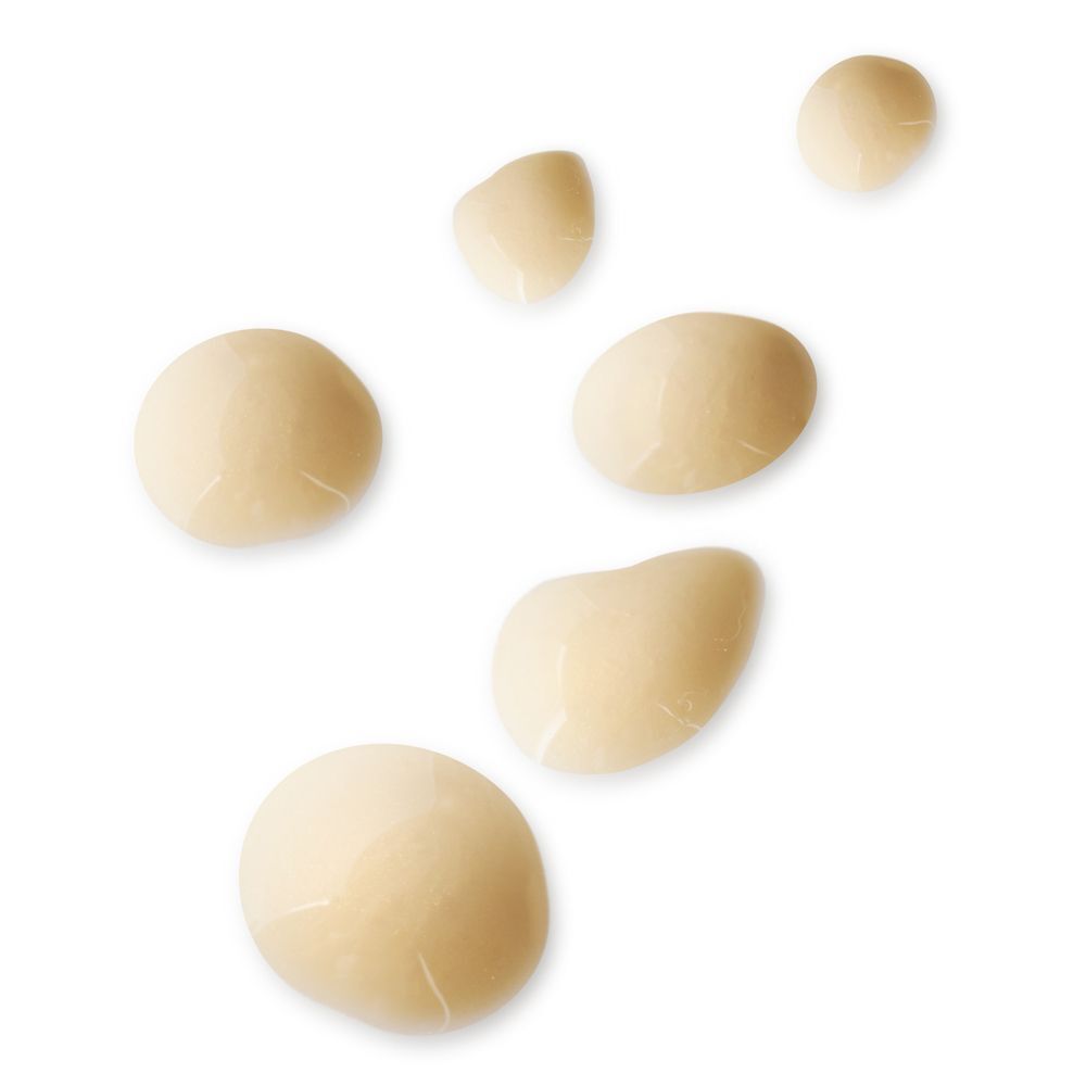 Diverse gocce del siero KORFF EYE Zone su sfondo bianco.
