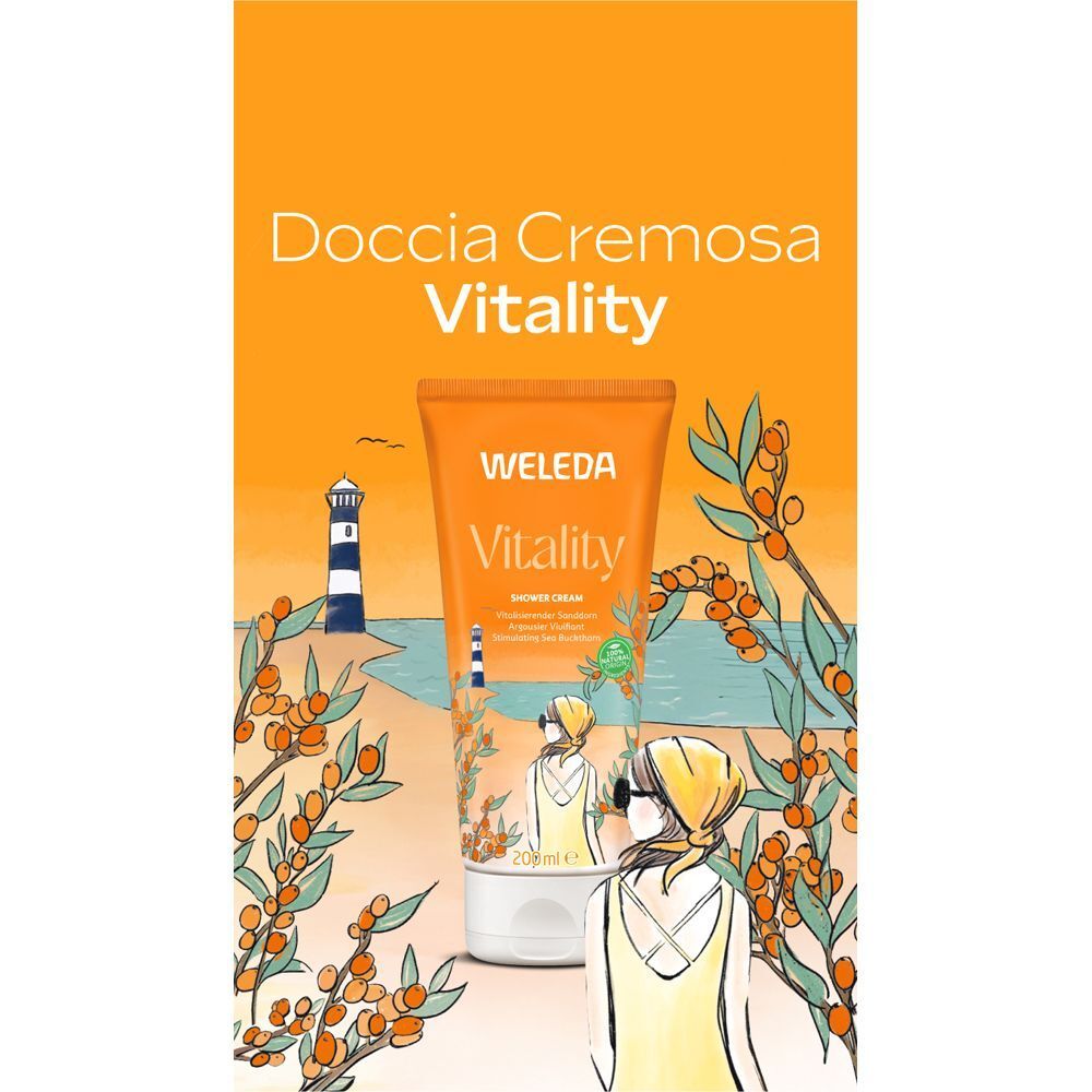 Tubo di crema doccia WELEDA Vitality davanti a un paesaggio costiero con olivello spinoso.