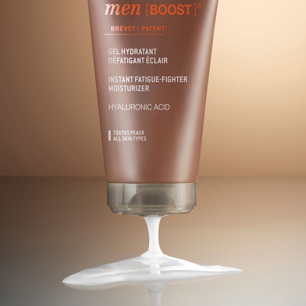 Tubetto Nuxe Men Gel Idratante Viso Energizzante con gel fuoriuscito.