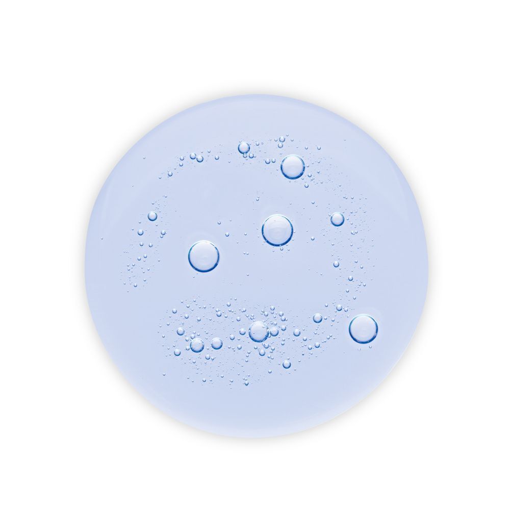 Goccia di shampoo Klorane con bolle d'aria.