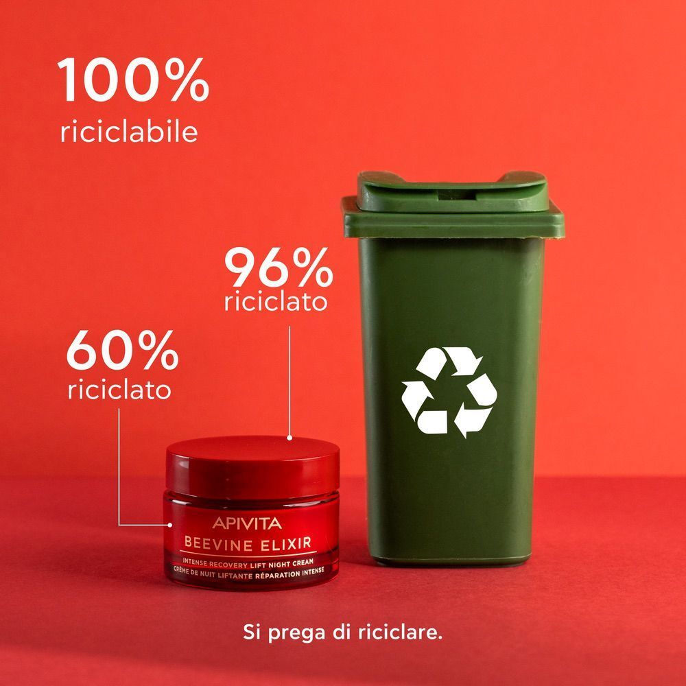 Vasetto Apivita Beevine Elixir accanto a un bidone di riciclaggio verde.