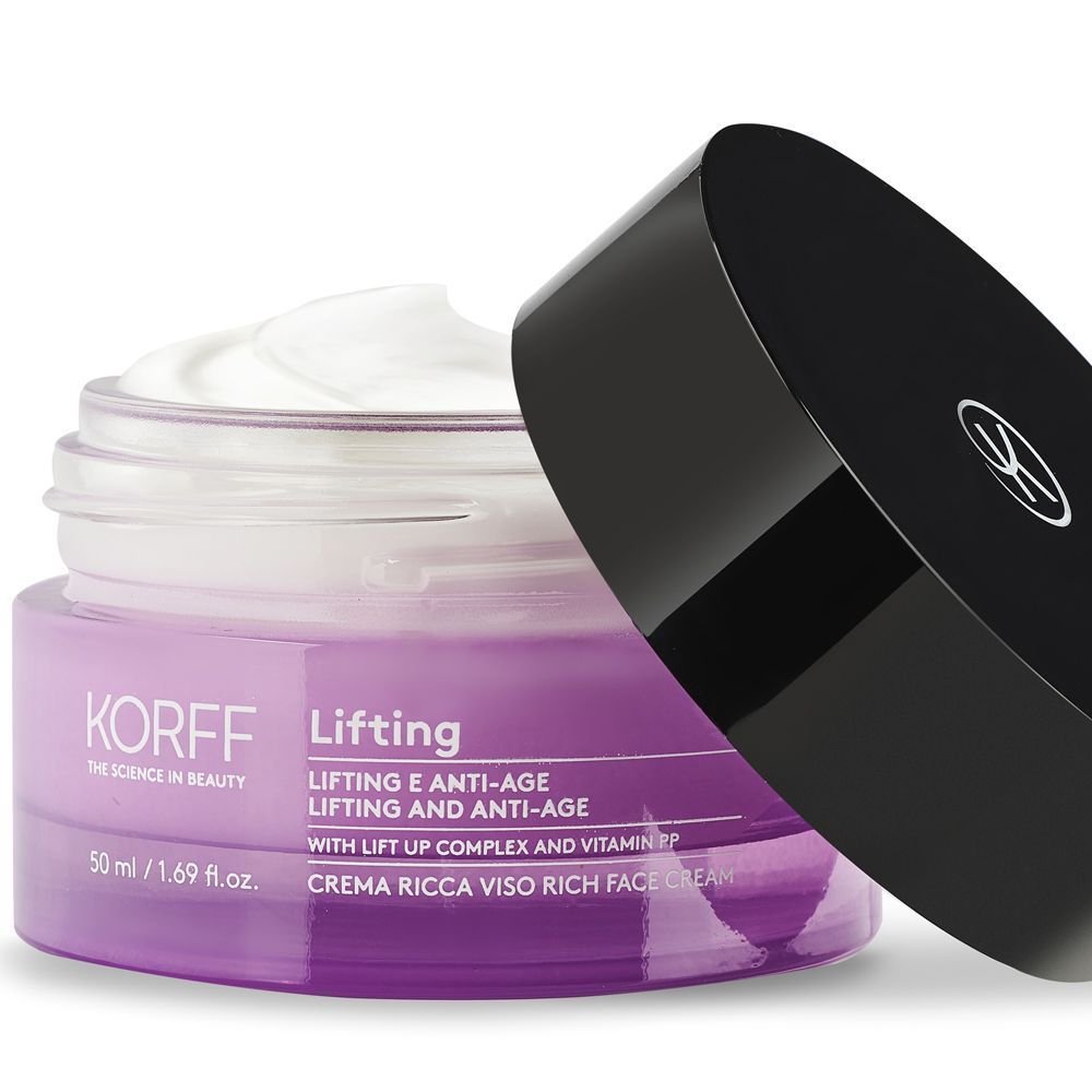 Un vasetto aperto di crema viso KORFF Lifting con crema bianca e il suo tappo nero accanto.