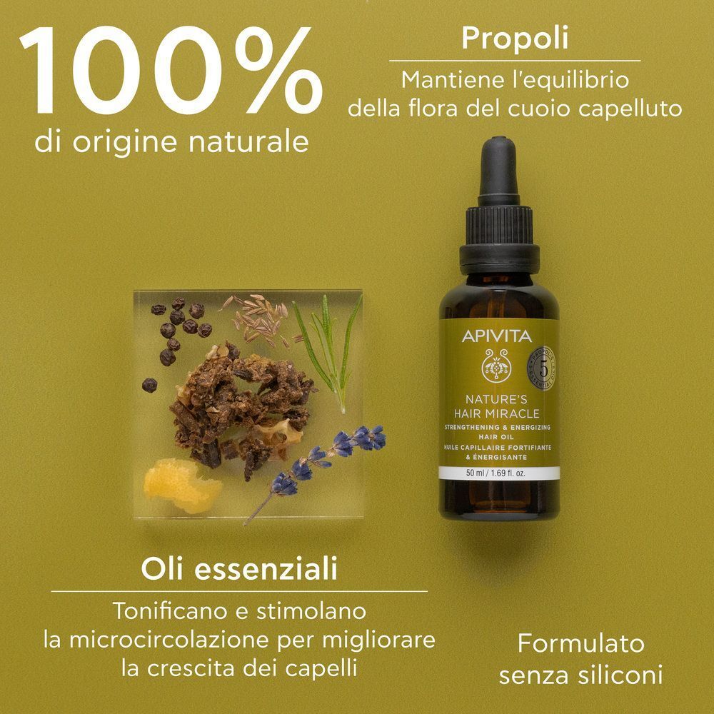 Flacone di olio per capelli APIVITA accanto a una ciotola di ingredienti naturali e testo sull'origine 100% naturale.