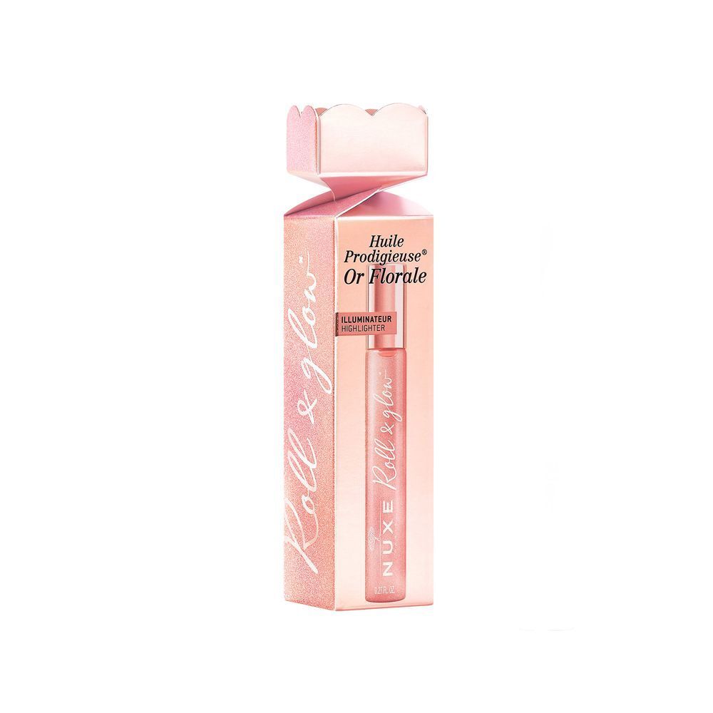 Un flacone roll-on Nuxe Huile Prodigieuse Or Florale in una scatola rosa.