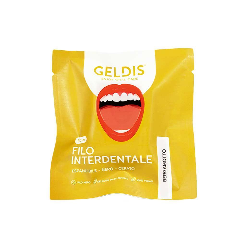 Confezione singola di filo interdentale Geldis al bergamotto, giallo con bocca aperta e denti.