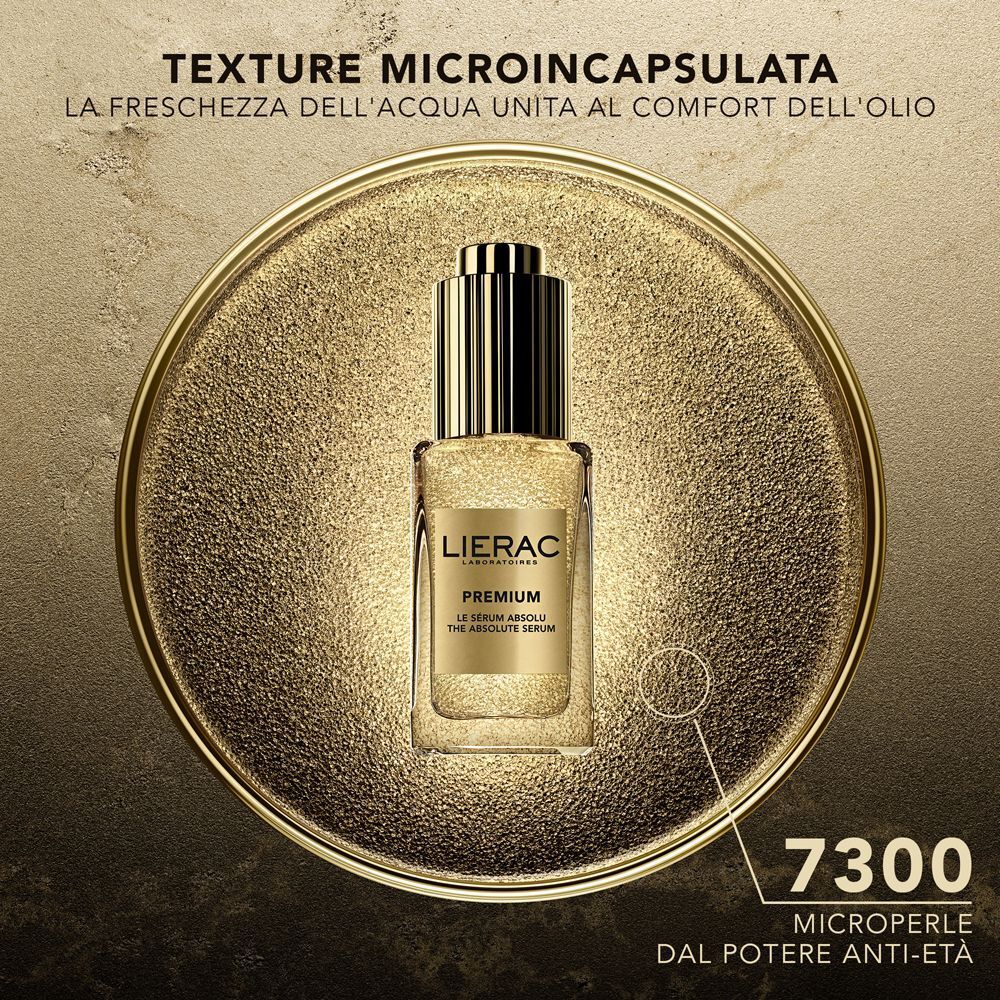 Flaconcino siero Lierac Premium su sfondo dorato, 7300 micro-perle.