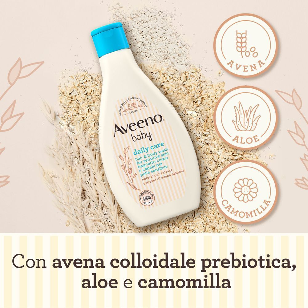 Flacone Aveeno Baby circondato da avena, aloe e camomilla.