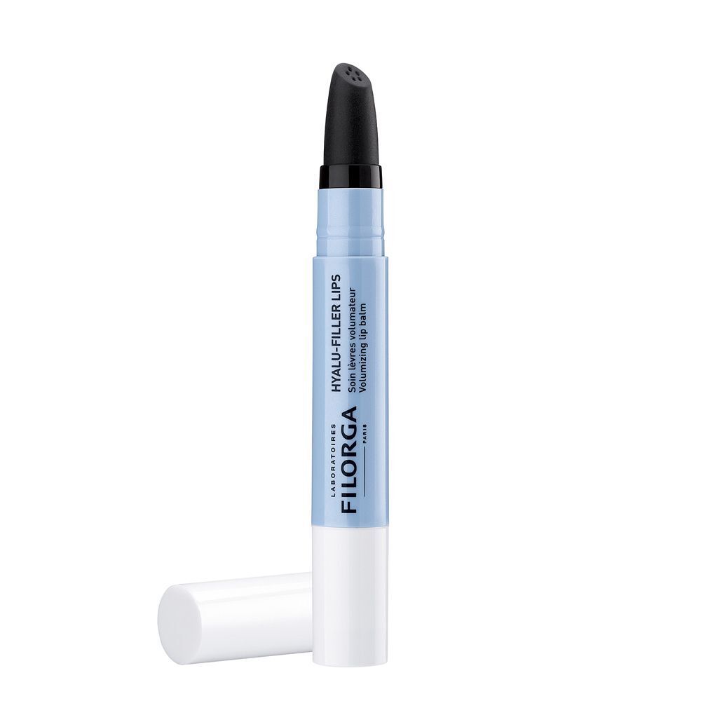 Un balsamo labbra Filorga Hyalu-Filler, aperto, con applicatore nero e tappo bianco.