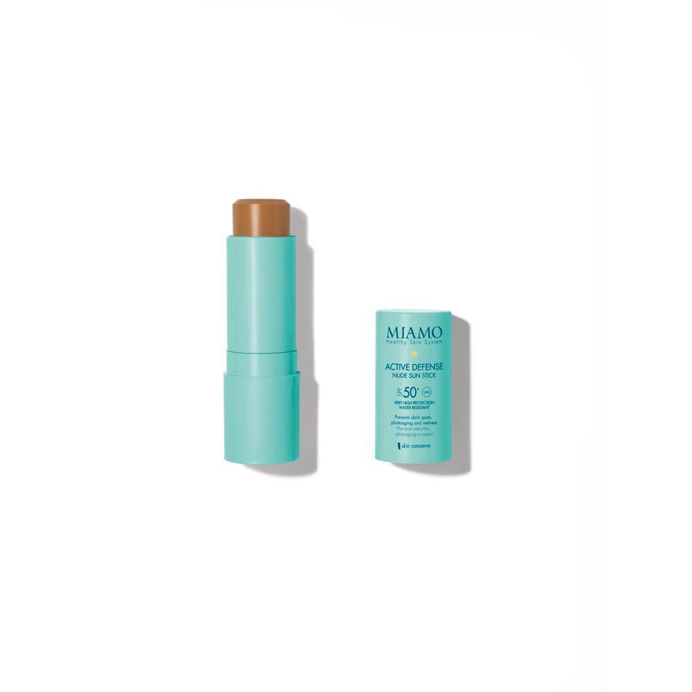 Un Miamo Active Defense Nude Sun Stick SPF50+ aperto, con il suo tappo chiuso accanto.