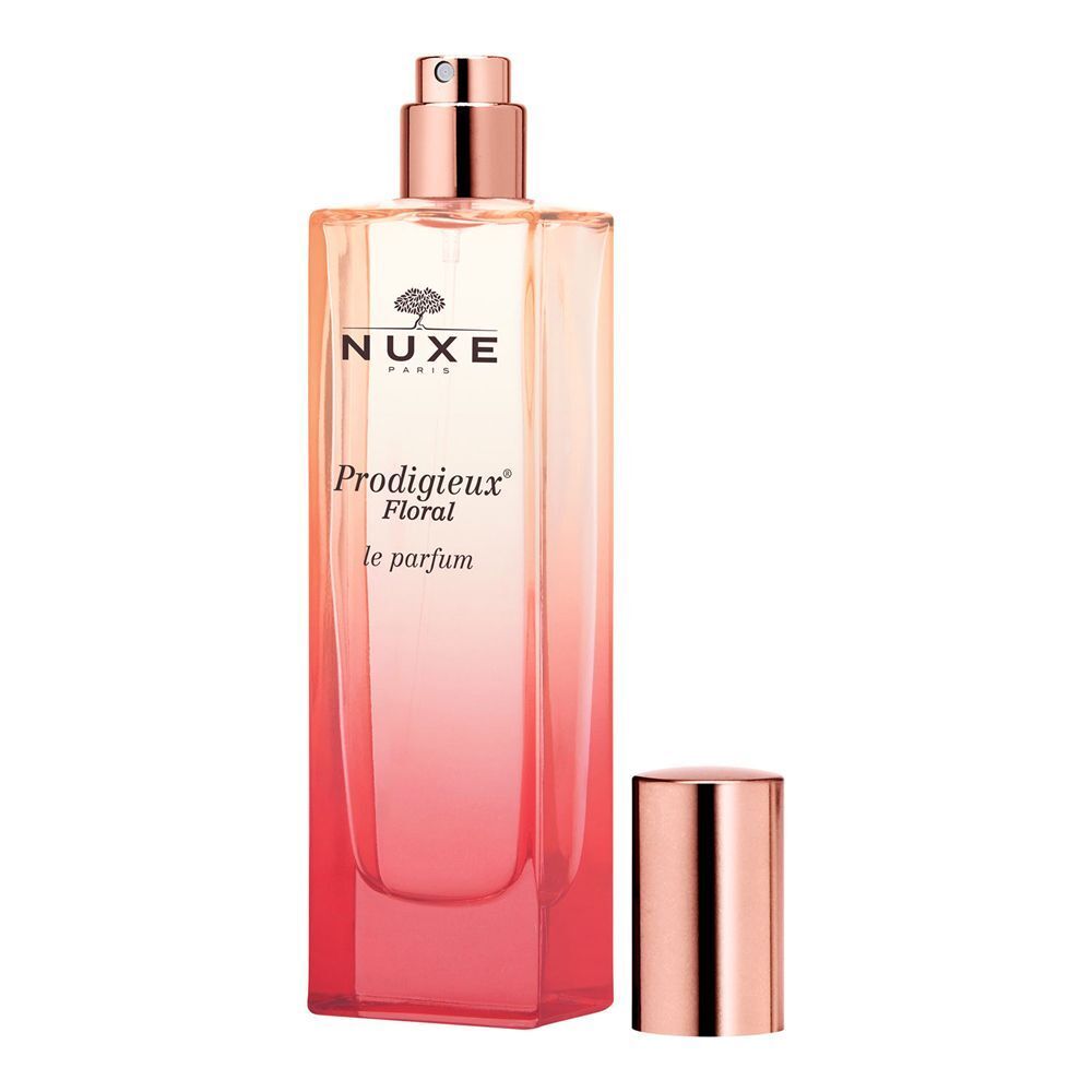 Flacone di Nuxe Prodigieux Floral Le Parfum aperto, con tappo color oro rosa accanto.