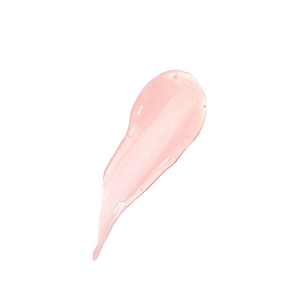 Una singola goccia di lucidalabbra rosa pallido adagiata su una superficie liscia.