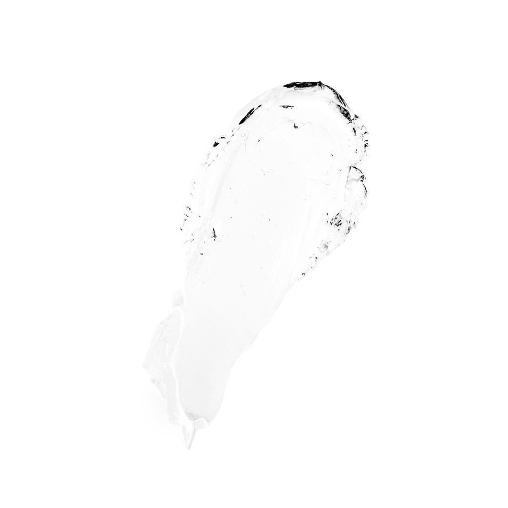 Una texture cremosa bianca con inclusioni gelatinose trasparenti su sfondo bianco.