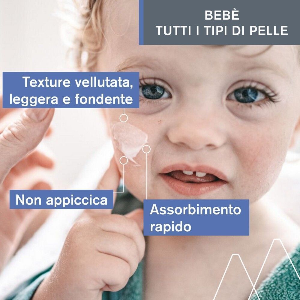 Viso di neonato con crema Uriage Bébé applicata. Texture vellutata, leggera e fondente.