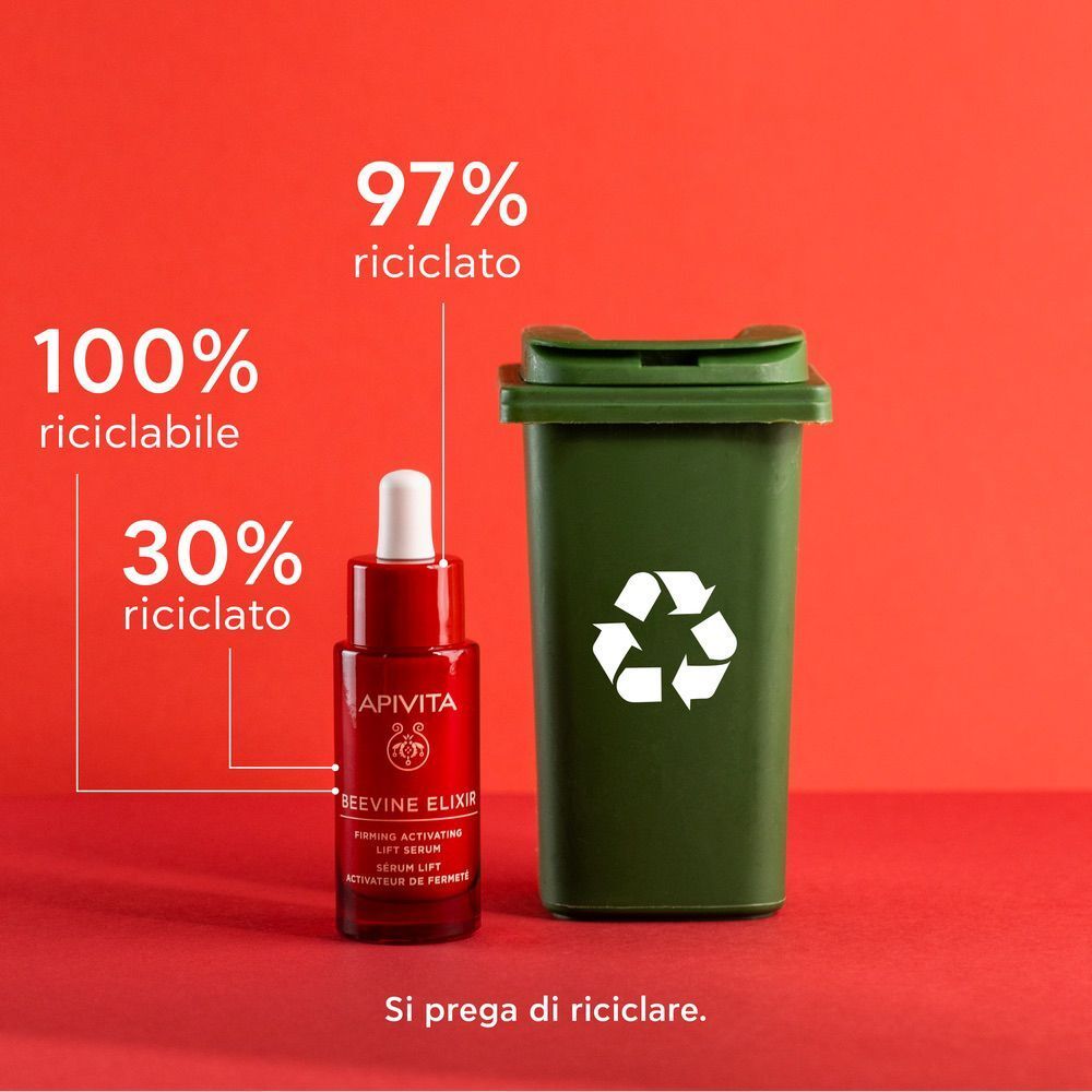 Siero Apivita Beevine Elixir accanto a un bidone di riciclaggio verde.