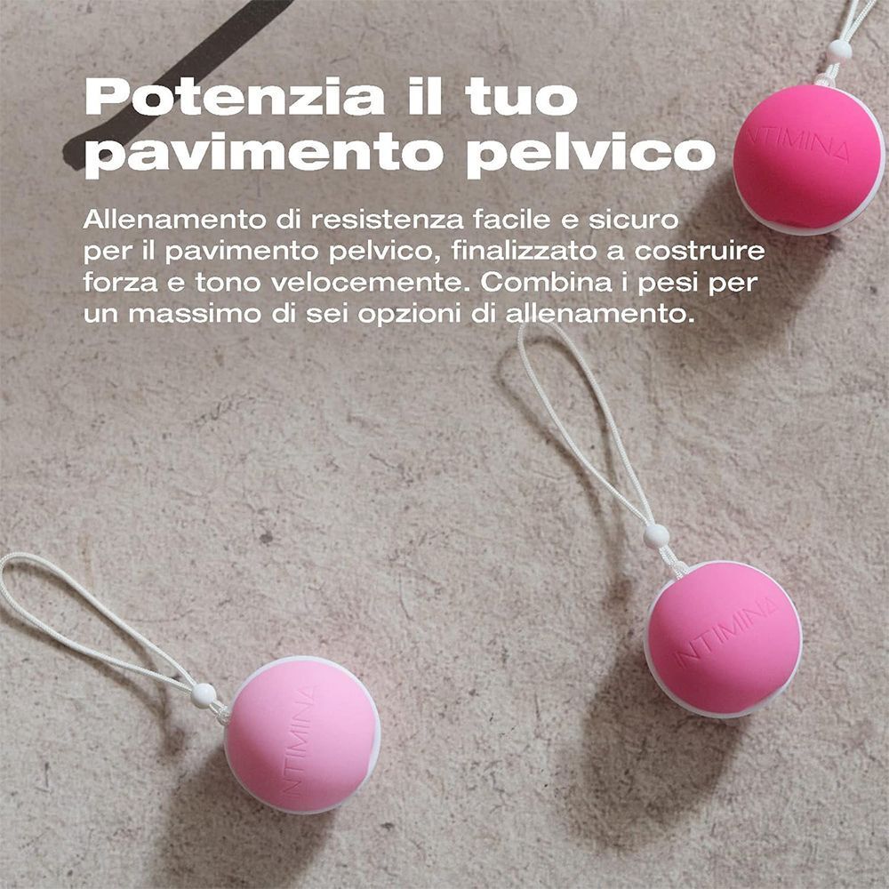 Tre sfere Kegel rosa con cordino su sfondo testurizzato.