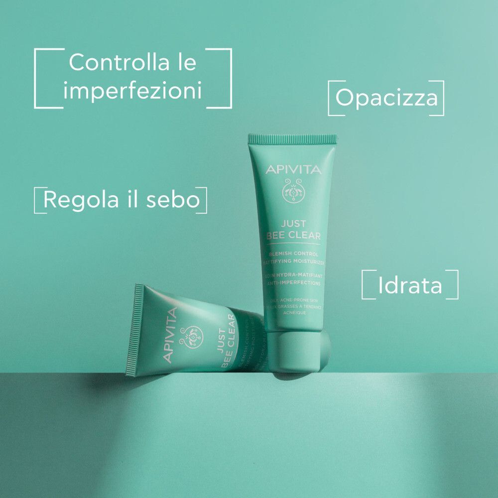 Due tubi di crema viso Apivita Just Bee Clear, uno sdraiato.