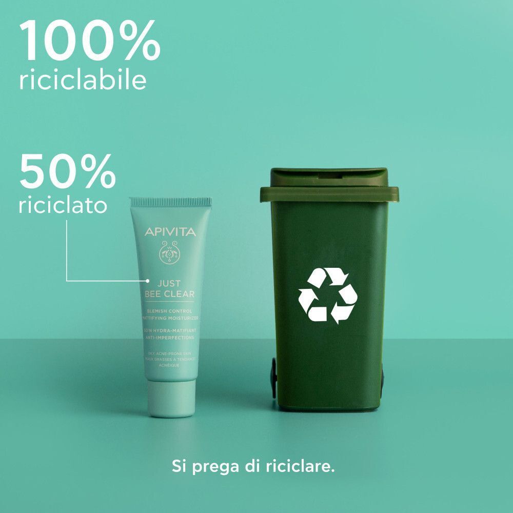 Crema viso Apivita Just Bee Clear accanto a un contenitore per il riciclo.