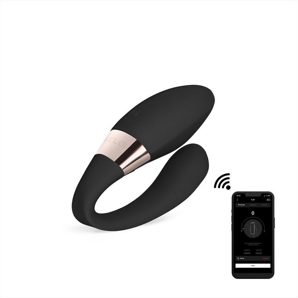 Vibratore nero a forma di U con accento oro rosa, collegato a uno smartphone che mostra un'app.