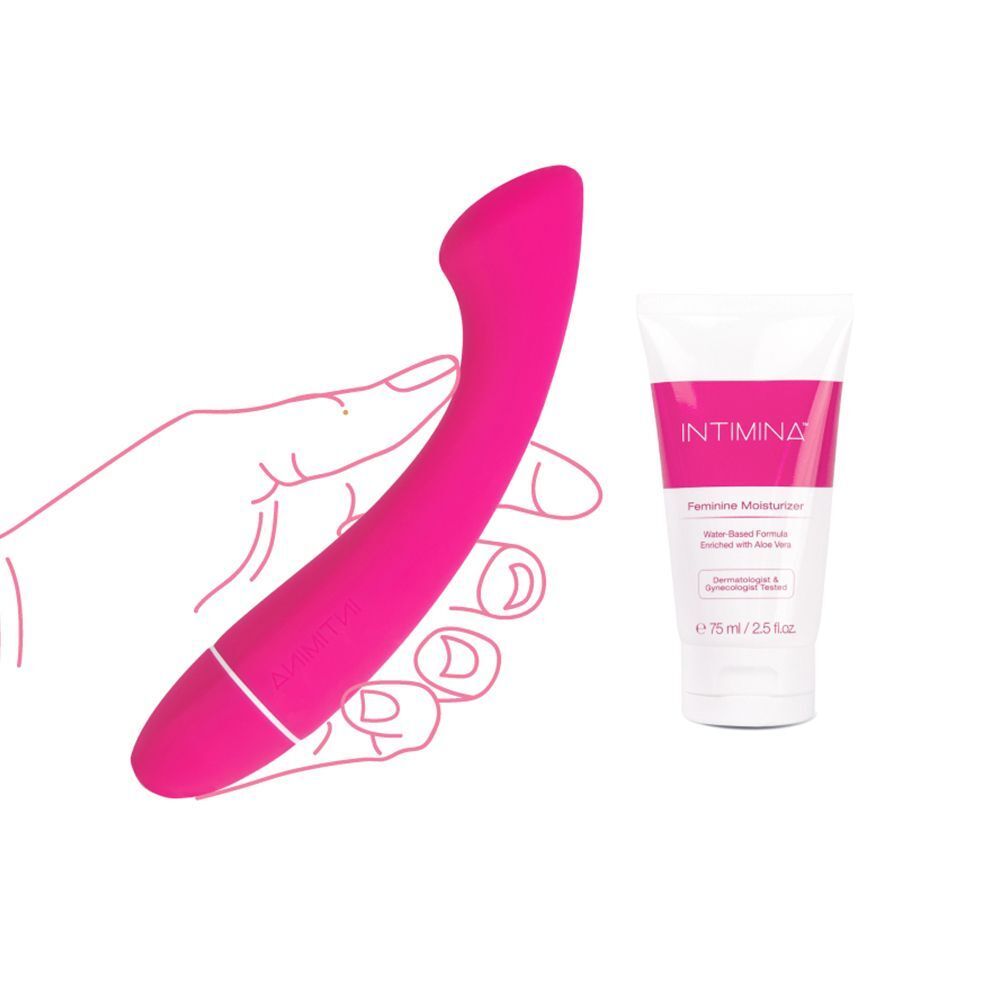 Mano che tiene un vibratore rosa accanto a un tubetto di crema idratante Intimina.