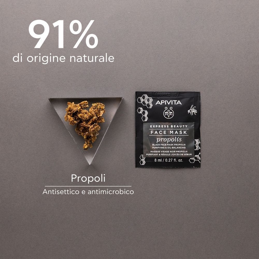 Maschera viso APIVITA EXPRESS BEAUTY Propoli, 8 ml, accanto a pezzi di propoli.